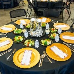 Gold and black guest table styled by A&A Events